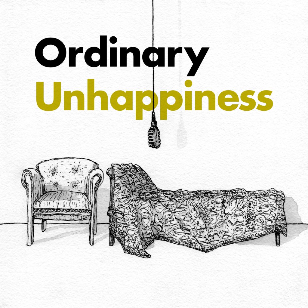 Ordinary Unhappiness podcast key art. A chair sits next to an analytic couch. Above it hangs a microphone in front of the title of the podcast.